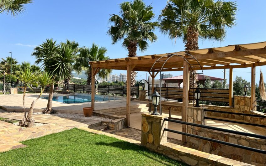 Detached villa with private pool within the site